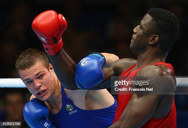 Efe Ajagba of Nigeria competes with Joseph Goodall of Australia during the Men's Super heavy +91 kg Semi-Finals Boxing at Scottish Exhibition And...