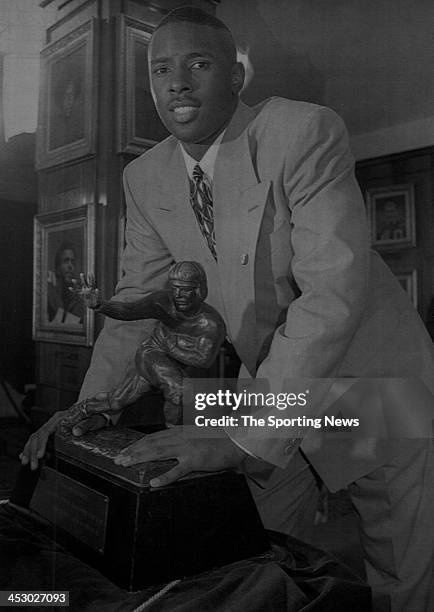 Charlie Ward of the Florida State Seminoles poses with the Heisman Trophy after he won the award on December 11, 1993 at the Downtown Athletic Club...