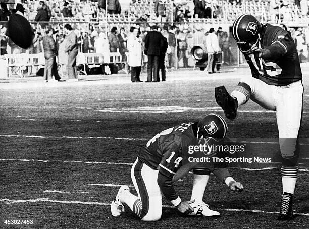 Jim Turner of the Denver Broncos and holder Norris Weese warm up against the Oakland Raiders on circa 1977 in Oakland, California.