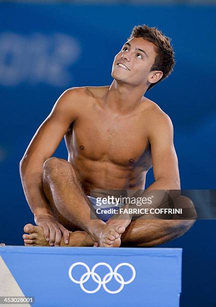 In this file picture taken on July 26, 2012 Britain's Tom Daley looks on during a training session at the Aquatics Center in London on the eve of the...