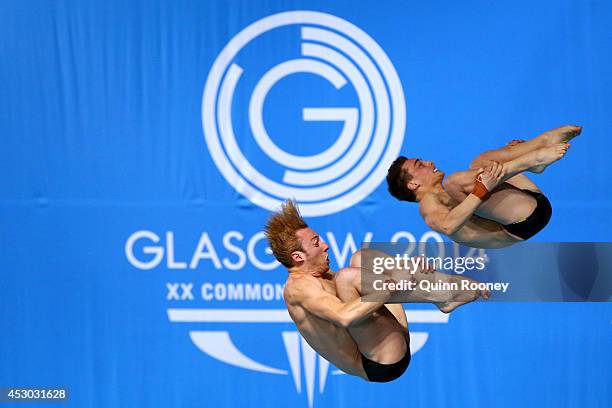 Domonoic Bedggood and Matthew Mitcham of Australia compete in the Men's Synchronised 10m Platform Final at Royal Commonwealth Pool during day nine of...