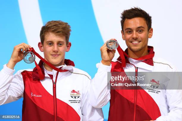 Silver medalists Tom Daley and James Denny of England pose during the medal ceremony for the Men's Synchronised 10m Platform Final at Royal...