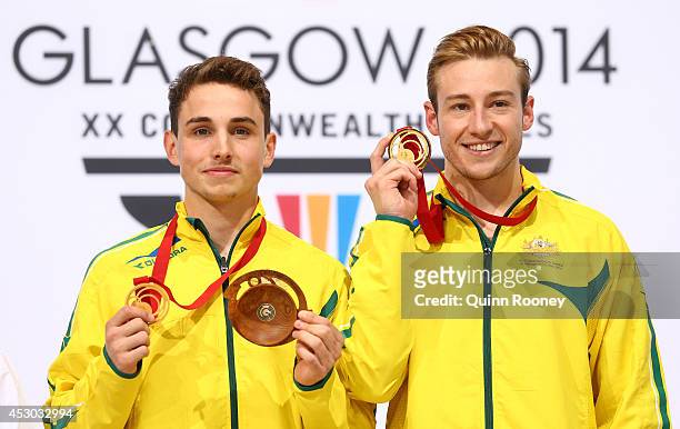 Gold medalists Domonic Bedggood and Matthew Mitcham of Australia pose during the medal ceremony in the Men's Synchronised 10m Platform Final at Royal...