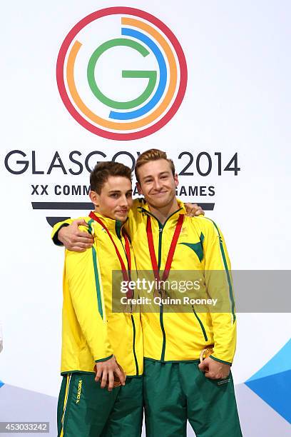 Gold medalists Domonic Bedggood and Matthew Mitcham of Australia celebrate during the medal ceremony in the Men's Synchronised 10m Platform Final at...