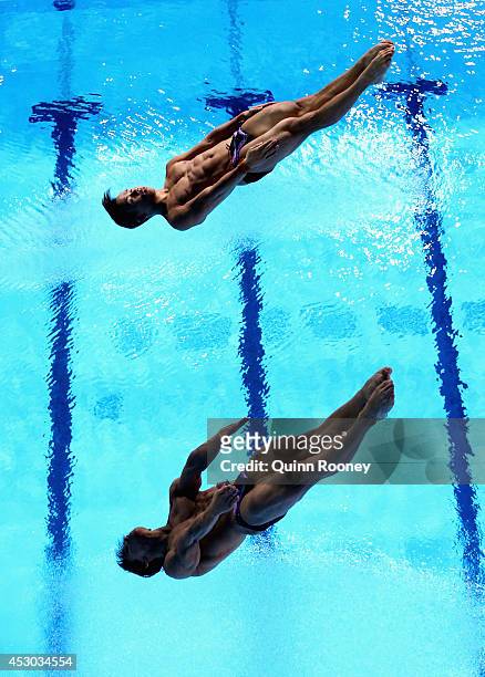 Ooi Tze Liang and Chew Yiwei of Malaysia compete in the Men's Synchronised 10m Platform Final at Royal Commonwealth Pool during day nine of the...