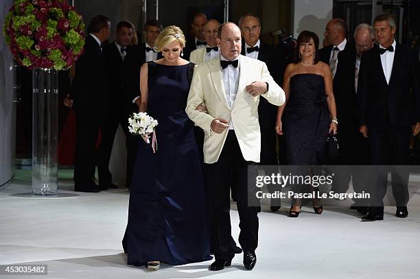 Princess Charlene of Monaco and Prince Albert II of Monaco attend the 66th Monaco Red Cross Ball Gala at Sporting Monte-Carlo on August 1, 2014 in...