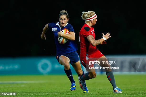 Caroline Ladagnous of France breaks through the Welsh defence during the IRB Women's Rugby World Cup Pool C match between France and Wales at the...