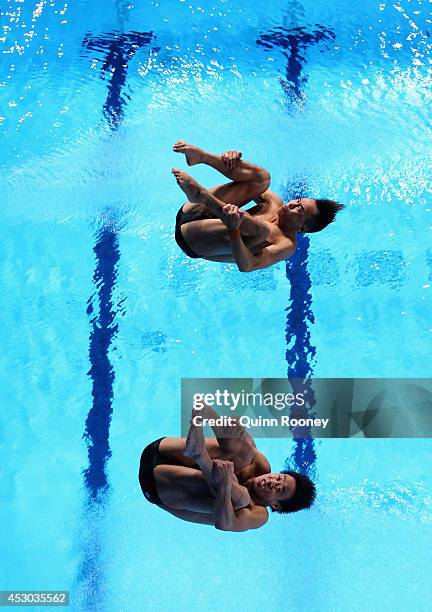 Ooi Tze Liang and Chew Yiwei of Malaysia compete in the Men's Synchronised 10m Platform Final at Royal Commonwealth Pool during day nine of the...