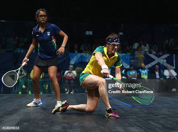 Rachael Grinham of Australia plays a shot during the women's doubles semifinal match againsts Joshana Chinappa and Dipika Pallikal of India at...