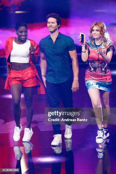 Jury members Nikeata Thompson, Howard Donald and Palina Rojinski smile during the 1st live show of 'Got to Dance' on August 1, 2014 in Cologne,...