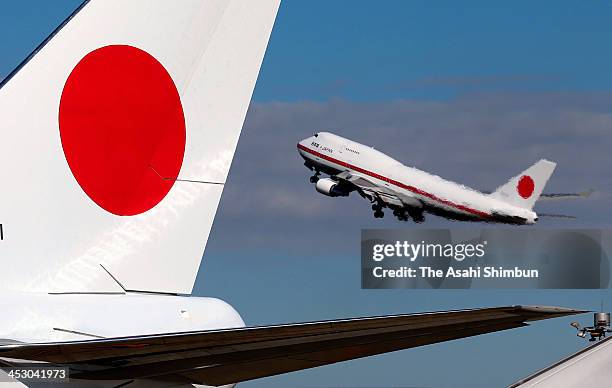 Government airplane taking Japan's Emperor Akihito and Empress Michiko takes off at Tokyo International Airport on November 30, 2013 in Tokyo, Japan....