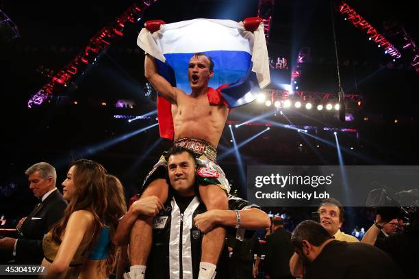 Evgeny Gradovich of Russia celebrates defeating Billy Dib of Australia during their 'Clash in Cotai' IBF Featherweight title bout on November 24,...