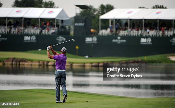 Bill Glasson hits his second shot on the 18th hole during the first round of the 3M Championship at TPC Twin Cities on August 1, 2014 in Blaine,...