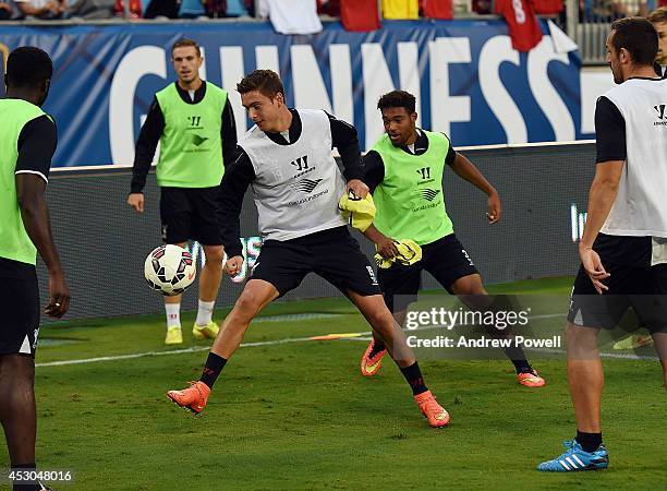 Kristoffer Peterson and Jordon Ibe of Liverpool in action during a open training session at Bank Of America Stadium on August 1, 2014 in Charlotte,...