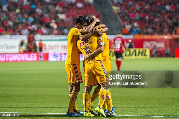 Players of Tigres celebrate after Juninho scored the tying goal during a match between Tijuana and Tigres UANL as part of 3rd round Apertura 2014...