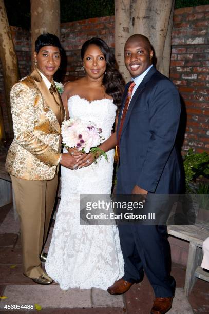 Referee Violet Palmer, Celebrity Hair Stylist Tanya Stein and Celebrity Event Planner William P. Miller pose for a photo after the marriage of Violet...