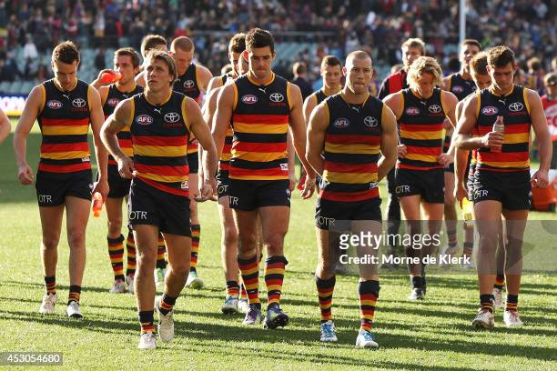 Crows players leave the field after the round 19 AFL match between the Adelaide Crows and the West Coast Eagles at Adelaide Oval on August 2, 2014 in...