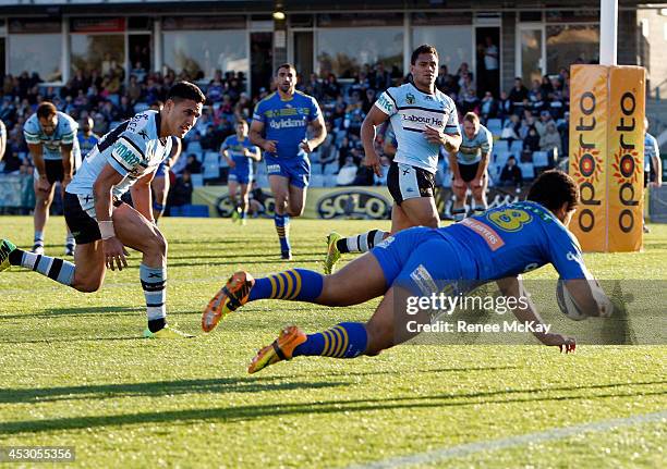 Bureta Faraimo of the Eels runs in a try during the round 21 NRL match between the Cronulla Sharks and the Parramatta Eels at Remondis Stadium on...