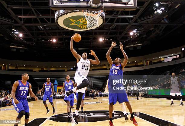 Eric Dawson of the Austin Toros drives to the basket against Thanasis Antetokounmpo of the Delaware 87ers on December 1, 2013 at the Cedar Park...