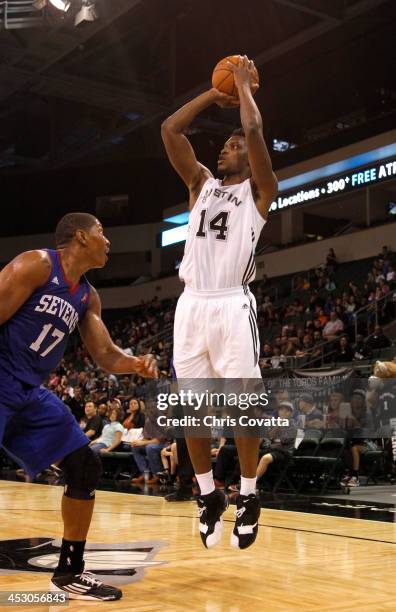 Terrance Woodbury of the Austin Toros shoots over Darin Mency of the Delaware 87ers on December 1, 2013 at the Cedar Park Center in Cedar Park,...