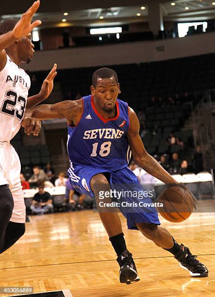 Damian Saunders of the Delaware 87ers drives around Eric Dawson of the Austin Toros on December 1, 2013 at the Cedar Park Center in Cedar Park,...