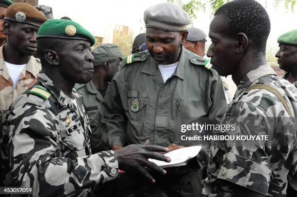 Mali junta leader Captain Amadou Sanogo speaks to his fellow soldiers at the Kati Military camp, in a suburb of Bamako, on March 22, 2012. Coup...