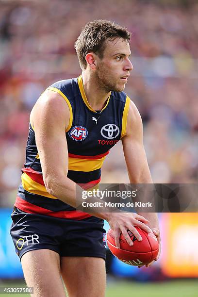 Brodie Smith of the Crows runs with the ball during the round 19 AFL match between the Adelaide Crows and the West Coast Eagles at Adelaide Oval on...