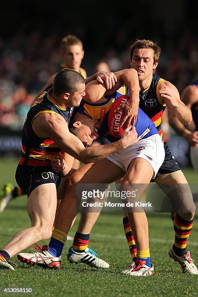 Brad Crouch of the Crows tackles Dom Sheed of the Eagles during the round 19 AFL match between the Adelaide Crows and the West Coast Eagles at...