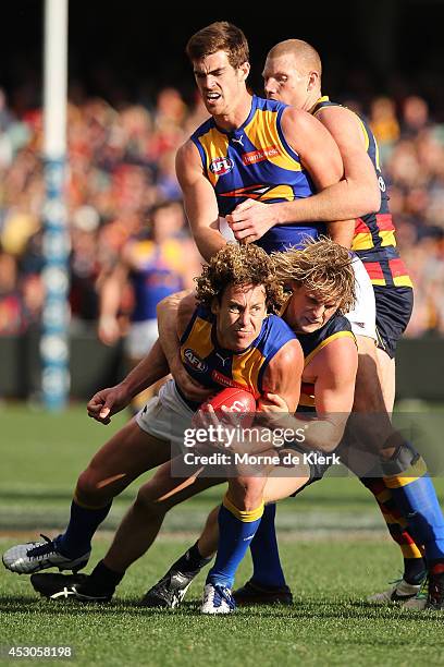 Matt Priddis of the Eagles is tackled by Rory Sloane of the Crows during the round 19 AFL match between the Adelaide Crows and the West Coast Eagles...