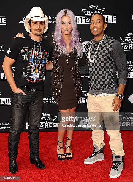 Brad Paisley, Kesha and Chris "Ludacris" Bridges attend the premiere of "Planes: Fire & Rescue" at the El Capitan Theatre on July 15, 2014 in...