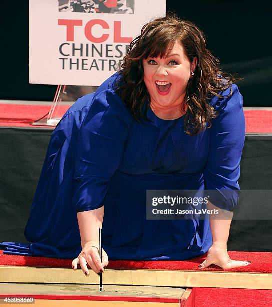 Actress Melissa McCarthy is immortalized with a hand and footprint ceremony at TCL Chinese Theatre on July 2, 2014 in Hollywood, California.