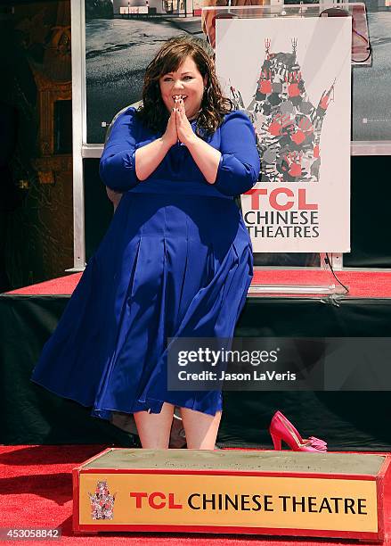 Actress Melissa McCarthy is immortalized with a hand and footprint ceremony at TCL Chinese Theatre on July 2, 2014 in Hollywood, California.