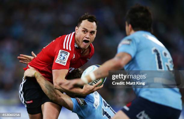 Israel Dagg of the Crusaders takes on the defence during the Super Rugby Grand Final match between the Waratahs and the Crusaders at ANZ Stadium on...