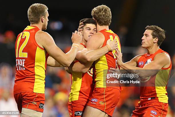 Jaeger O'Meara of the Suns celebrates a goal during the round 19 AFL match between the Gold Coast Suns and the St Kilda Saints at Metricon Stadium on...