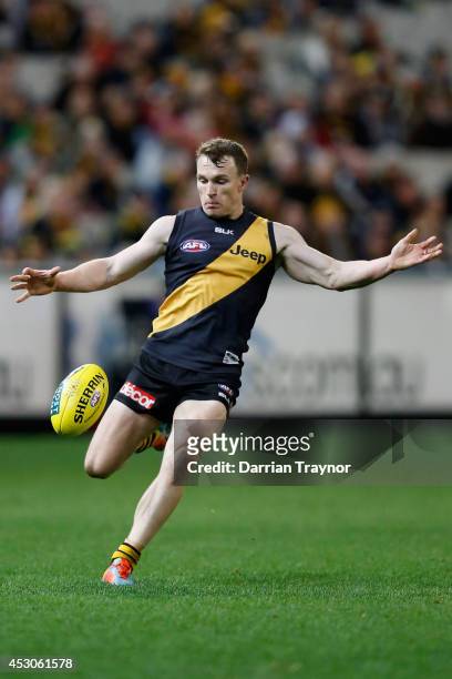 Nathan Foley of the Tigers kicks the ball during the round 19 AFL match between the Richmond Tigers and the Greater Western Sydney Giants at...
