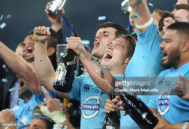 Waratahs captain Michael Hooper celebrates with team mates after victory in the Super Rugby Grand Final match between the Waratahs and the Crusaders...