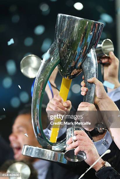 Waratahs players hold aloft the winning trophy after victory in the Super Rugby Grand Final match between the Waratahs and the Crusaders at ANZ...