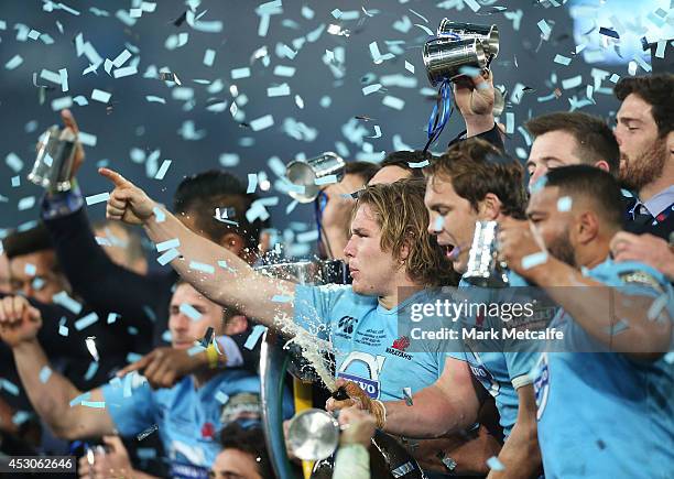 Waratahs captain Michael Hooper celebrates with team mates after victory in the Super Rugby Grand Final match between the Waratahs and the Crusaders...