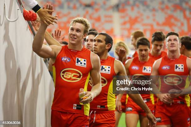Tom Lynch of the Suns celebrate winning the round 19 AFL match between the Gold Coast Suns and the St Kilda Saints at Metricon Stadium on August 2,...