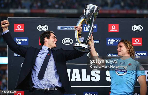 Dave Dennis and Michael Hooper of the Waratahs hold the trophy after winning the Super Rugby Grand Final match between the Waratahs and the Crusaders...