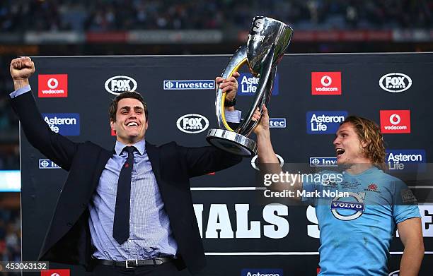 Dave Dennis and Michael Hooper of the Waratahs hold the trophy after winning the Super Rugby Grand Final match between the Waratahs and the Crusaders...