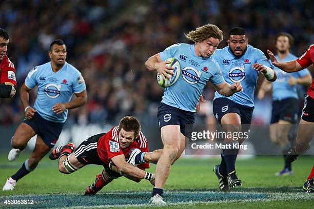 Michael Hooper of the Waratahs makes a break during the Super Rugby Grand Final match between the Waratahs and the Crusaders at ANZ Stadium on August...