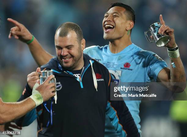 Waratahs coach Michael Cheika and Israel Folau celebrate victory in the Super Rugby Grand Final match between the Waratahs and the Crusaders at ANZ...