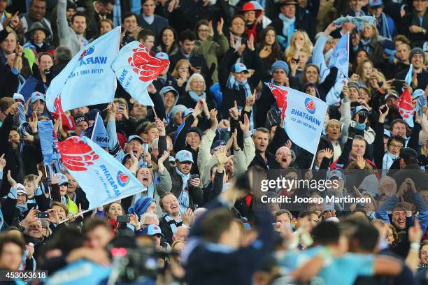 Waratahs fans cheer during the Super Rugby Grand Final match between the Waratahs and the Crusaders at ANZ Stadium on August 2, 2014 in Sydney,...