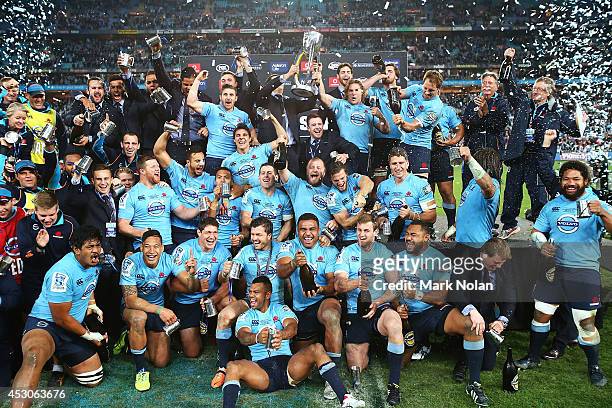 Waratahs players celebrate after winning during the Super Rugby Grand Final match between the Waratahs and the Crusaders at ANZ Stadium on August 2,...