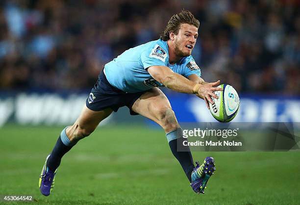 Rob Horne of the Waratahs fumbles the ball during the Super Rugby Grand Final match between the Waratahs and the Crusaders at ANZ Stadium on August...