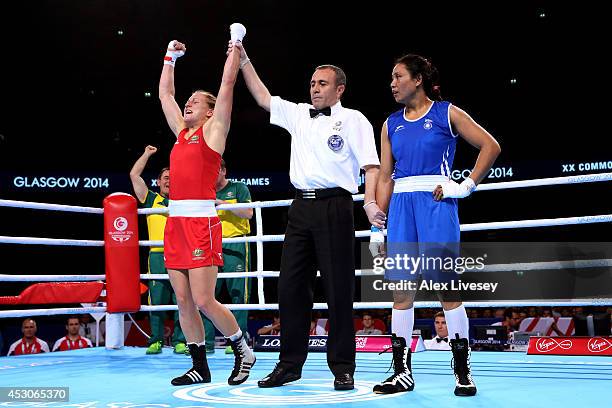 Shelley Watts of Australia celebrates winning the gold medal against Laishram Devi of India in the Women's Light Final at SSE Hydro during day ten of...