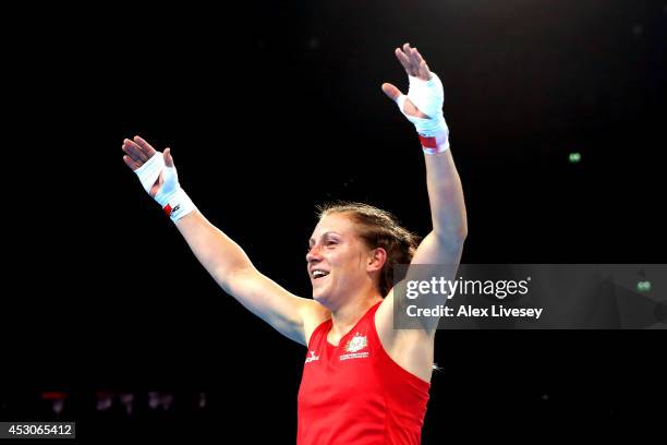 Shelley Watts of Australia celebrates winning the gold medal against Laishram Devi of India in the Women's Light Final at SSE Hydro during day ten of...