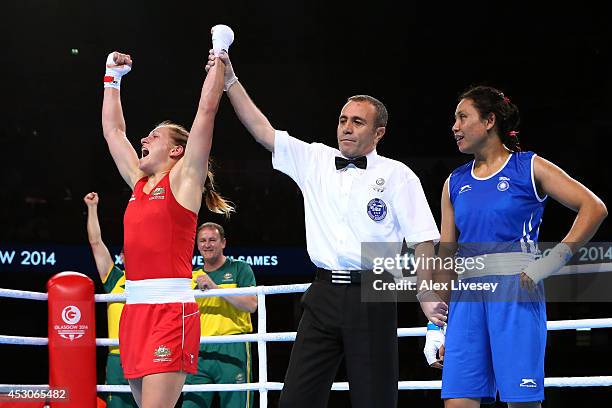 Shelley Watts of Australia celebrates winning the gold medal against Laishram Devi of India in the Women's Light Final at SSE Hydro during day ten of...