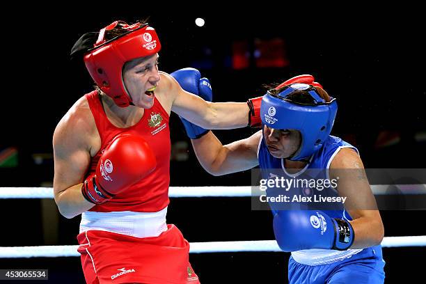 Shelley Watts of Australia competes against Laishram Devi of India in the Women's Light Final at SSE Hydro during day ten of the Glasgow 2014...